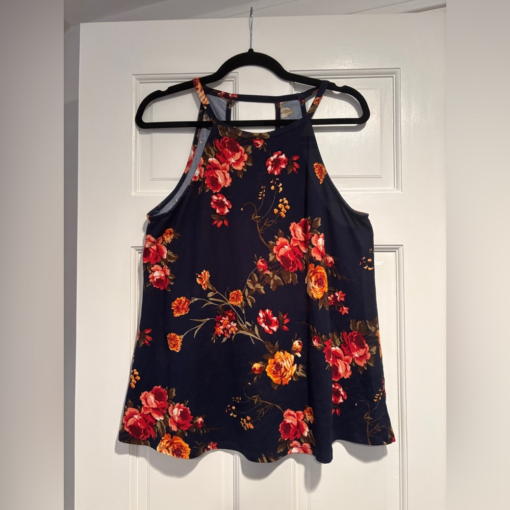 Blue tank with flower print 
Polyester and spandex